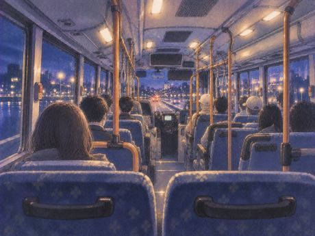 夜のバスの後部座席から前方を眺める景色